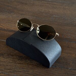 Prada 65ZS Sunglasses with Gold Frame and Green Lenses